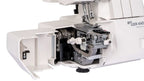 Close-up of an overlocker machine's needle and mechanism on a white background