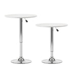 wo white round tables with chrome legs on a white background