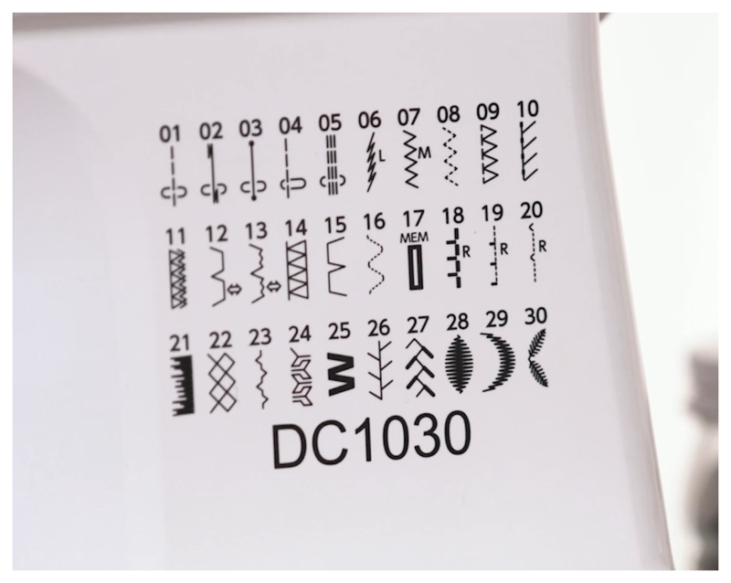 Patterned fabric with embroidery designs and number DC1030 on a white backgroun