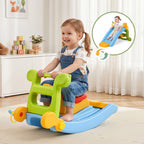Child playing with a colorful toy slide and rocker in a room.
