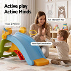 Woman and child playing with a colorful slide toy in a room with educational posters on the wall.