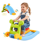 Child playing on a colorful toy with a slide attachment on a white background