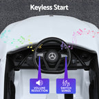 Car dashboard with steering wheel and keyless start feature highlighted, featuring volume reduction and switch songs options.