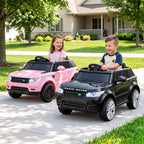 Two children playing with toy cars on a driveway