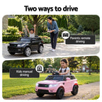 Two children playing with toy cars, one with remote control and the other manually driving.