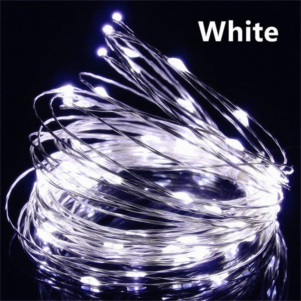 Coiled string of white LED lights on a black background