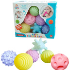 Colorful baby squeeze balls with packaging on a white background