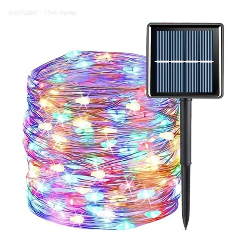 Multicolor solar string lights with a coiled wire and star-shaped LEDs, shown next to a black rectangular solar panel on a stake, on a white background.