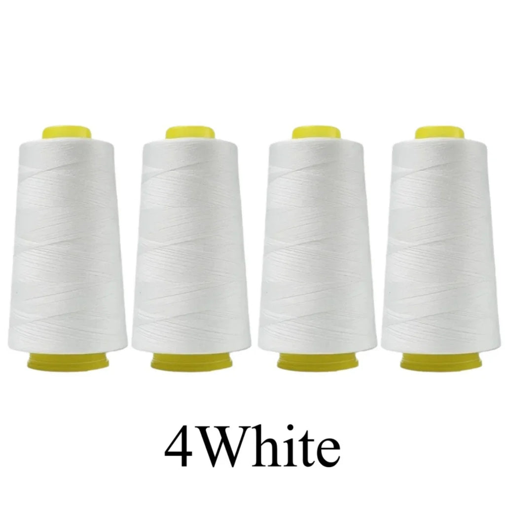 Four spools of white thread with yellow ends on a white background