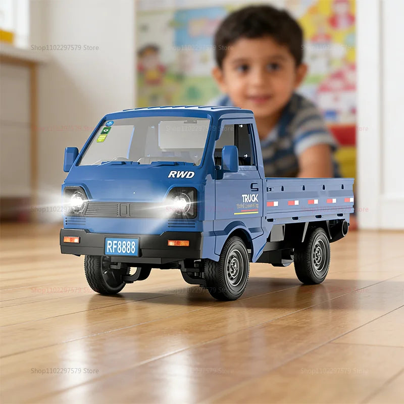 Blue toy truck on a wooden floor with a child in the background