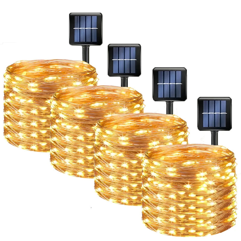 Set of solar-powered string lights with solar panels on a white background