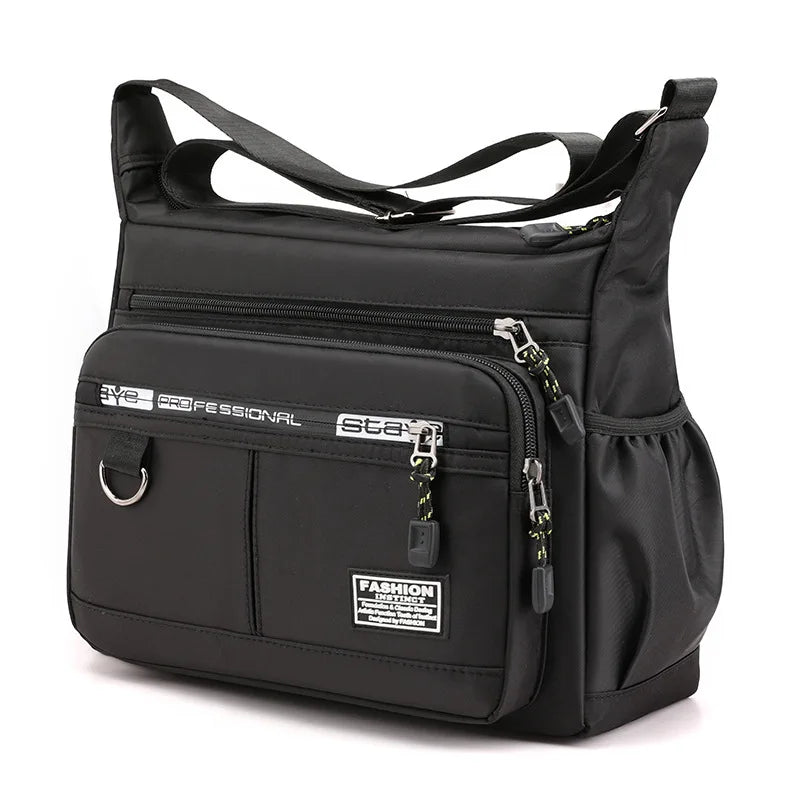 Black shoulder bag with multiple zippers and straps on a white background