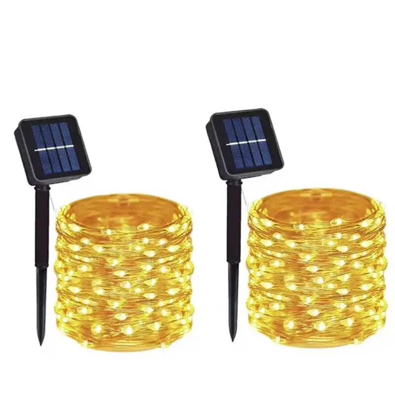 Two solar-powered string lights with visible LEDs on a white background