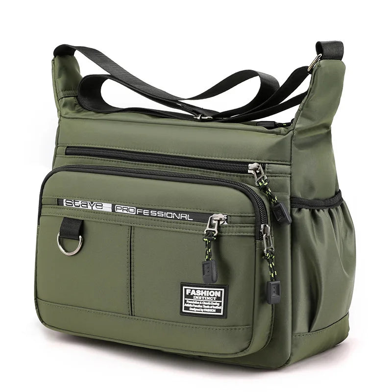 Green shoulder bag with multiple pockets and zippers on a white background