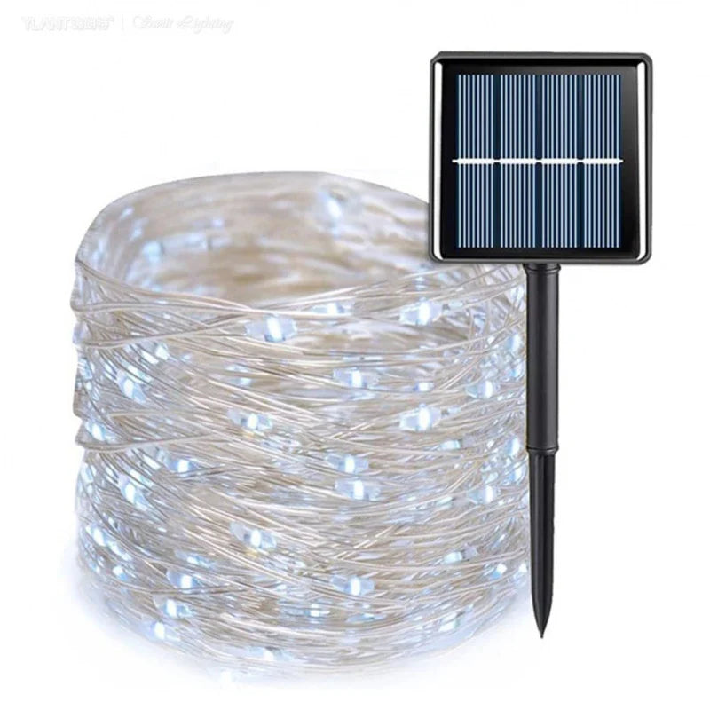 Solar-powered string lights with a solar panel and stake on a white background