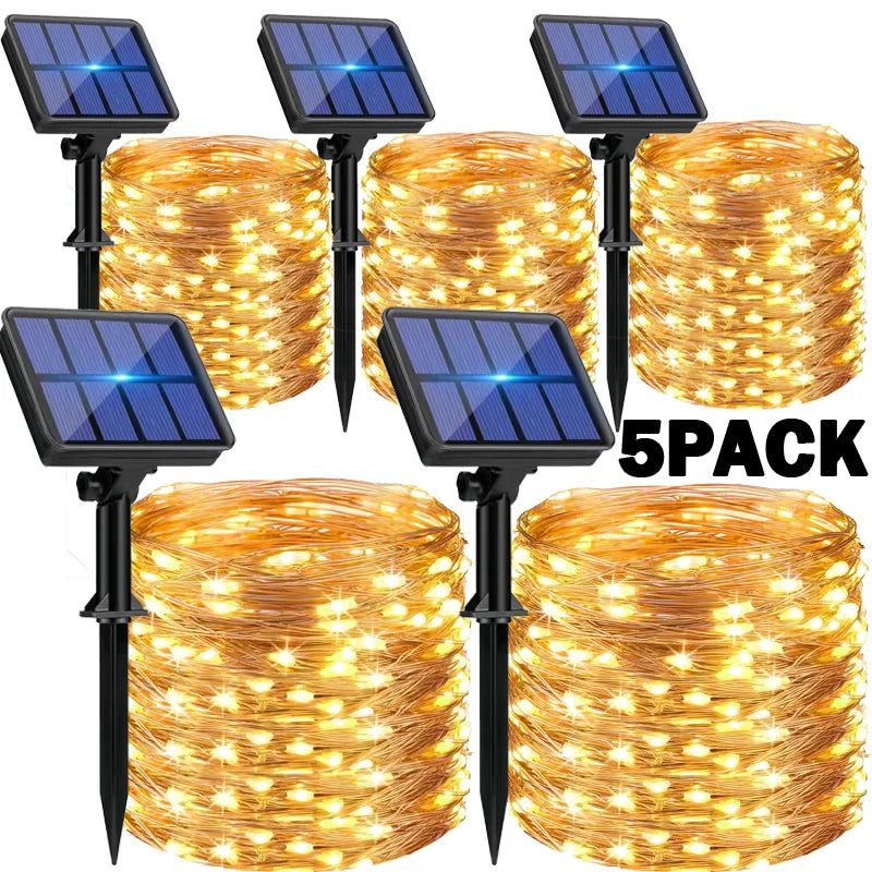 Five packs of solar-powered string lights with solar panels on a white background.