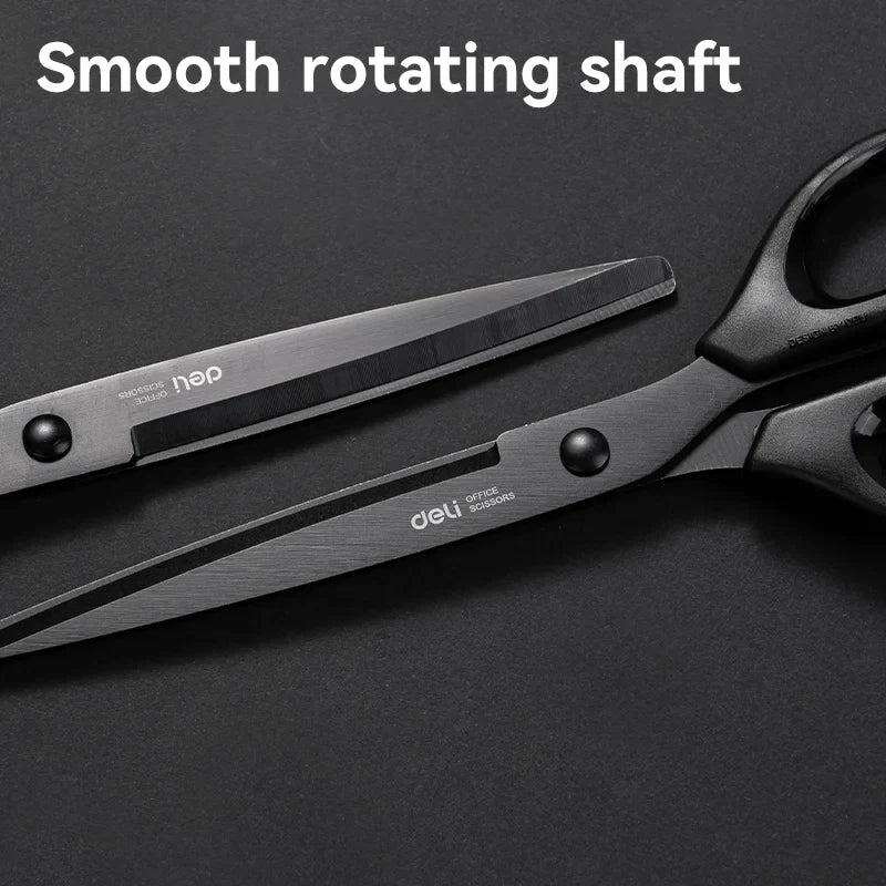 Black scissors with smooth rotating shaft on a dark background
