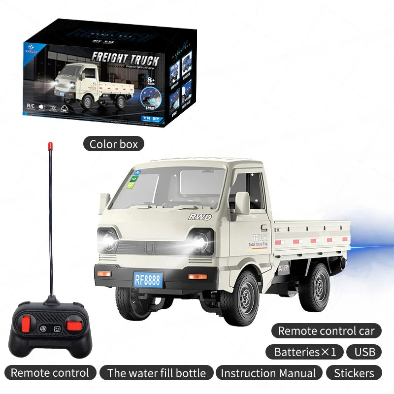 A toy remote control miniature freight truck set, featuring a cream-colored truck model, a black remote control with red buttons, its retail packaging box, and a 'Color box' container, all displayed on a clean white background with text overlays detailing the package contents.