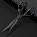 Black scissors with 'deli' branding on a black background