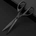 Black scissors with 'deli' branding on a black background