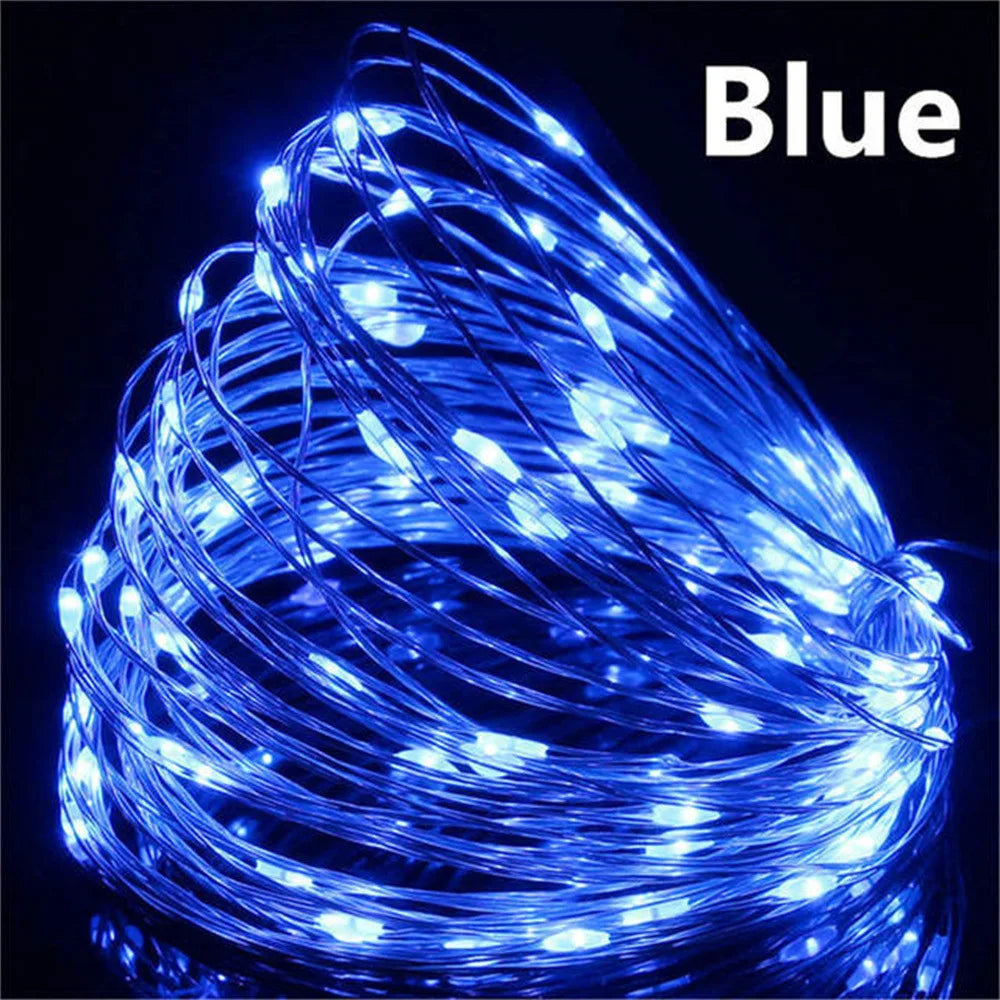 Coiled blue LED string light on a black background with 'Blue' text above