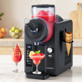 Devanti ice cream maker with red slushy, cones, and glasses on a kitchen counter.