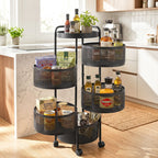 Black three-tier rolling cart in a kitchen with various items on each shelf.