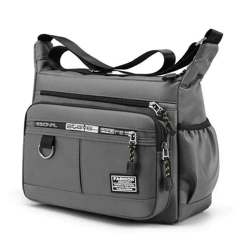 Gray shoulder bag with multiple zippers on a white background