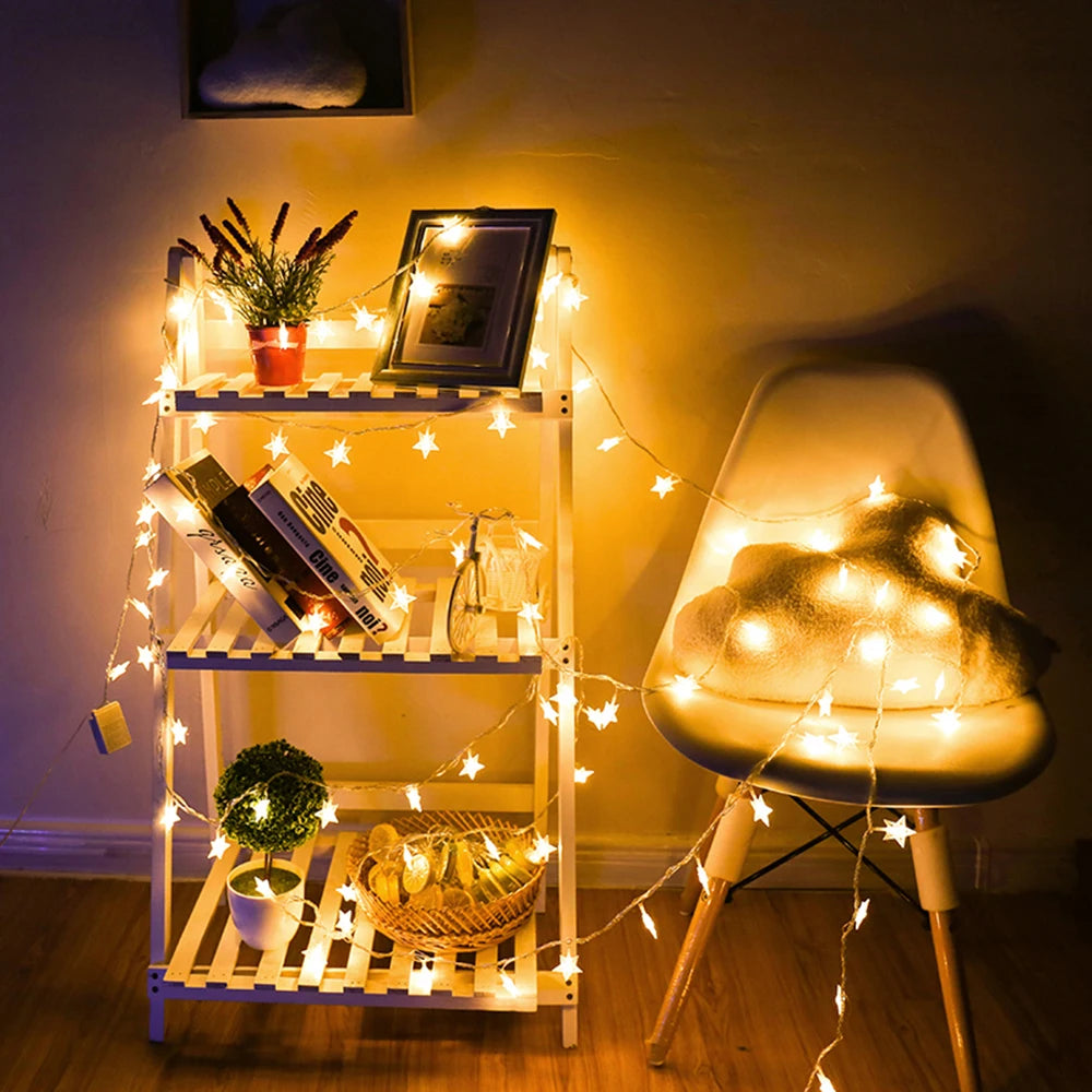Decorative string lights on a shelf and chair in a cozy room.