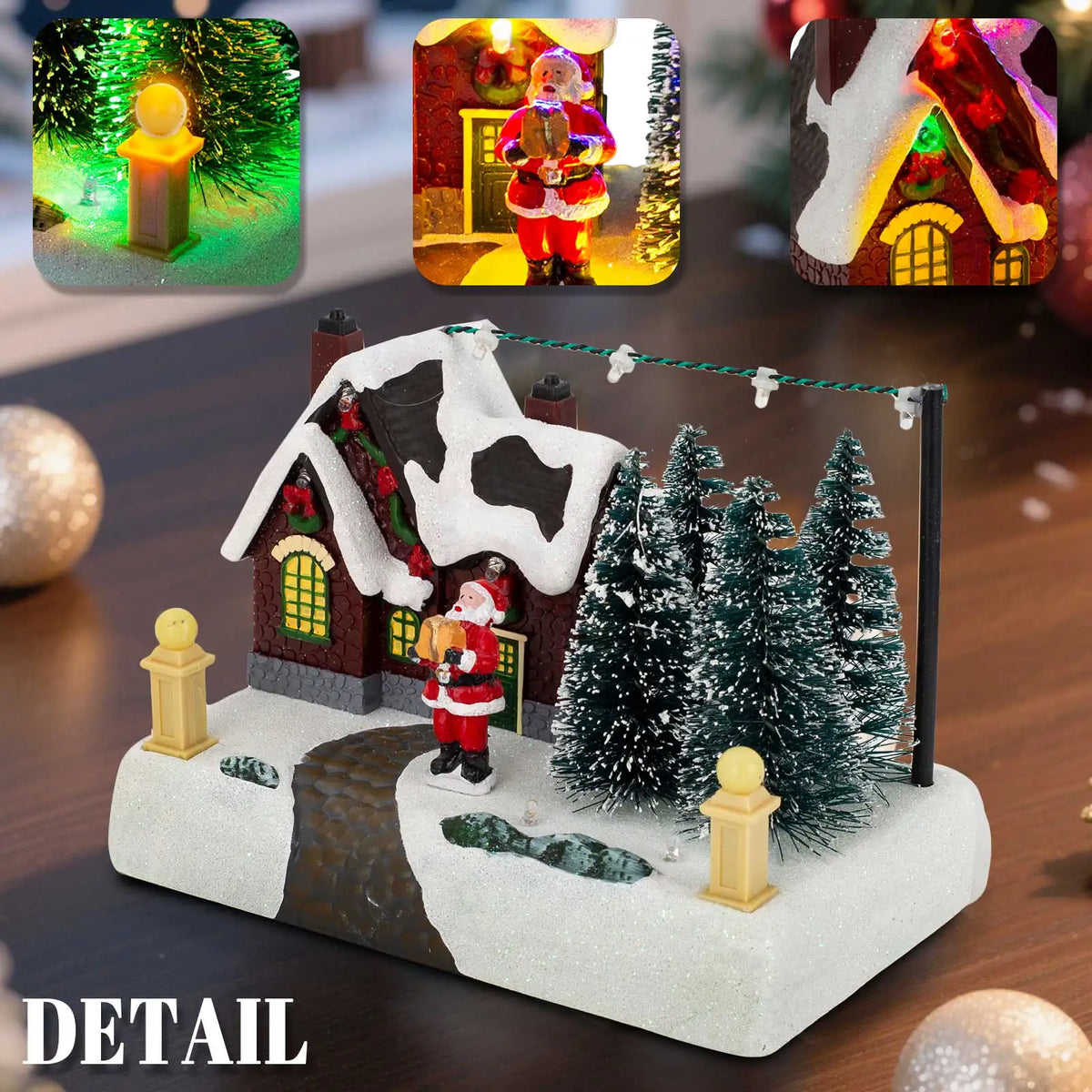 Christmas-themed miniature village scene with Santa Claus, trees, and a house on a wooden surface.