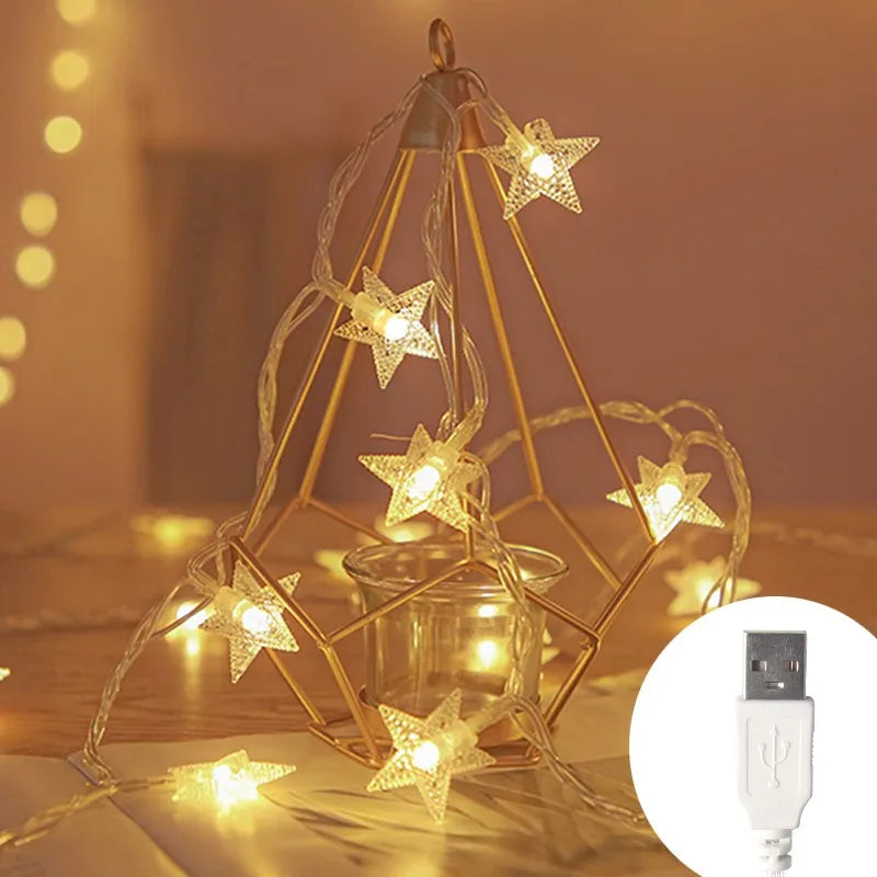 Decorative star-shaped string lights on a geometric metal stand with a USB cable inset.