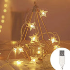 Decorative star-shaped string lights on a geometric metal stand with a USB cable inset.
