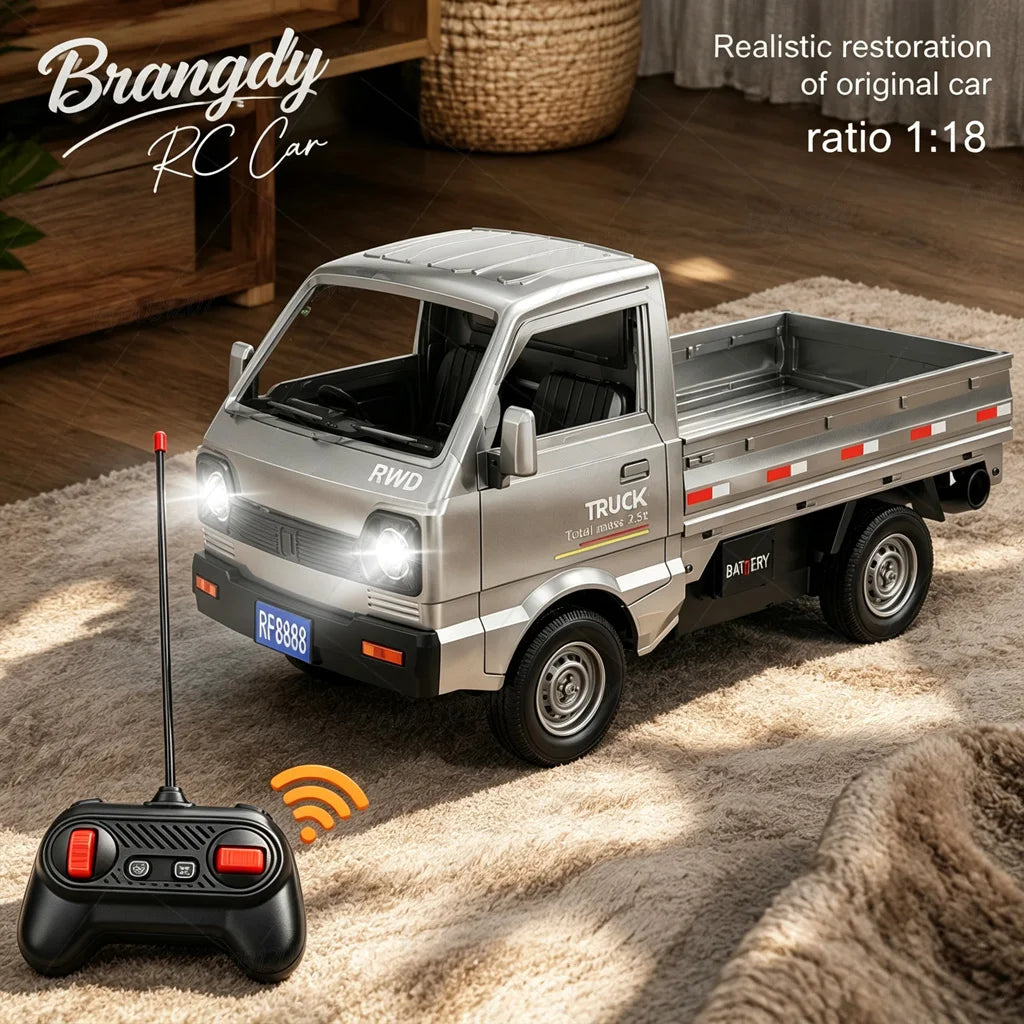 A silver remote-controlled toy pickup truck shown on a beige rug in a home setting, with a black remote control in the foreground and text overlays reading 'Brangdy RC Car' and 'Realistic restoration of original car ratio 1: