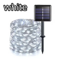 White solar garden string lights with a coiled wire and a small rectangular solar panel on a stake, shown on a white background with the word 'white' in the top left.