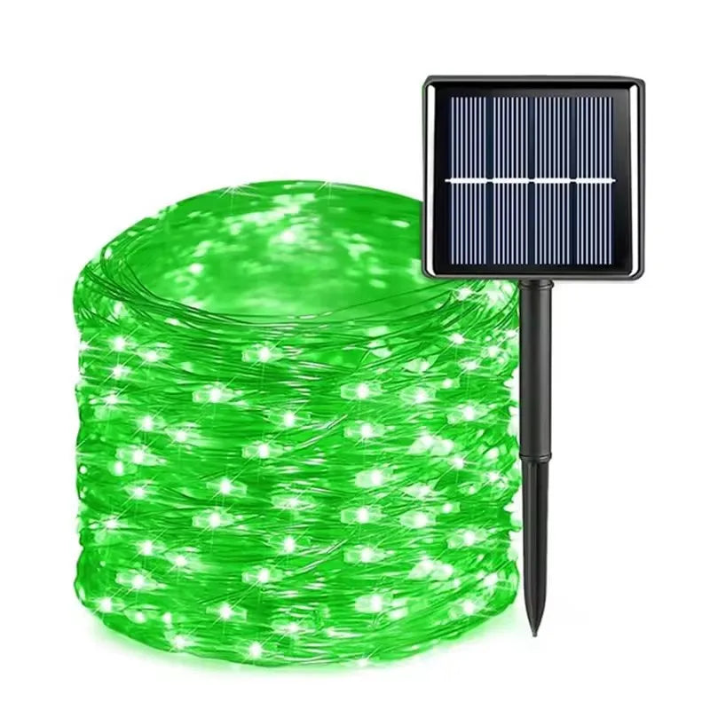 Green string lights with solar panel on a white background