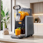 Nord juicer with a glass of orange juice on a kitchen counte