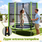 A children's trampoline with a green frame, black jumping mat, and tall black safety net enclosure, shown outdoors on grass with a man holding the net and a girl jumping inside. Text at the bottom reads 'Zipper entrance trampoline' and a circular inset shows a close-up of the zipper area.