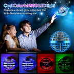 Children interacting with an RGB LED light ball against a dark sky background.