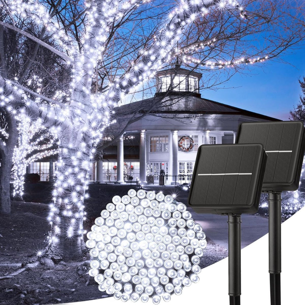 Solar string lights on trees with a gazebo in the background