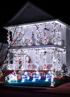 House decorated with Christmas lights and ornaments at night