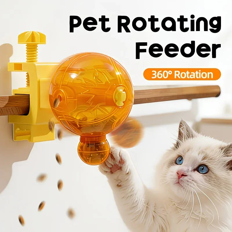 A cat interacting with a yellow and orange pet rotating feeder mounted on a wall, with text reading 'Pet Rotating Feeder' and '360° Rotation'.