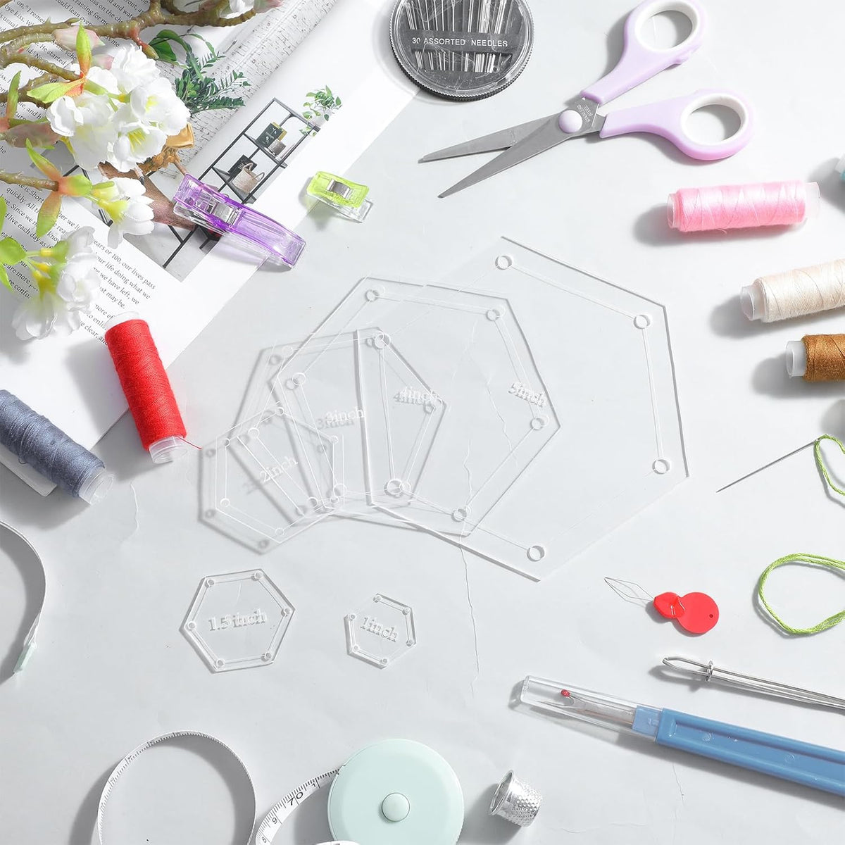 Quilting tools and materials on a white surface