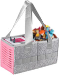 Gray and pink storage caddy with handles filled with colorful items on a white background