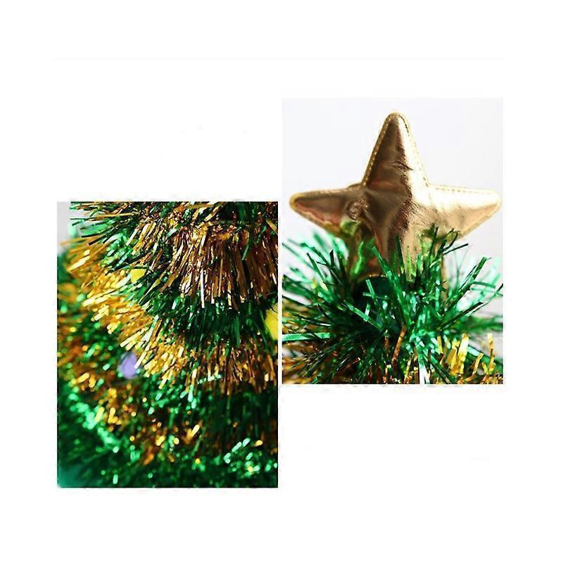 Gold star tree topper on a green tinsel background