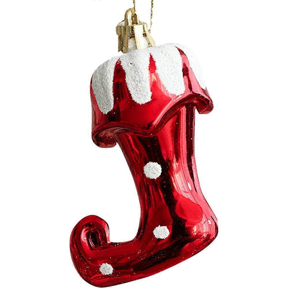 Red glass boot ornament with white snow-like texture on a white background