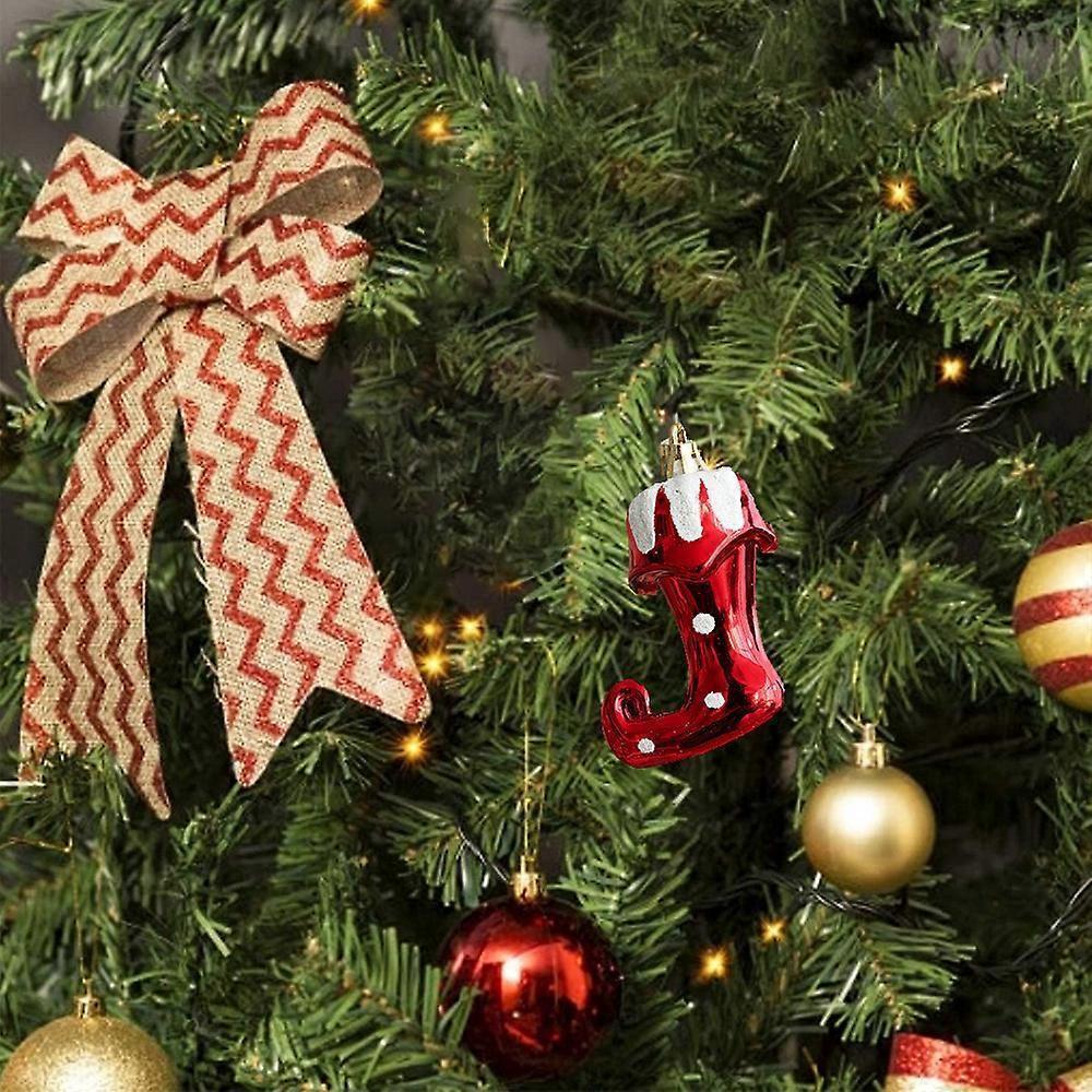 Decorative Christmas tree with ornaments and a large bow.