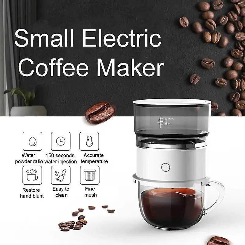 Small electric coffee maker with coffee beans and a cup of coffee on a white background
