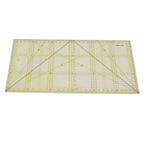 Clear acrylic ruler with grid lines on a white background