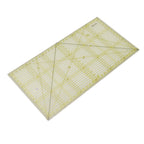 Rectangular grid ruler with yellow lines on a white background