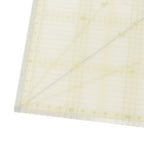 Light-colored fabric with a subtle pattern on a white background